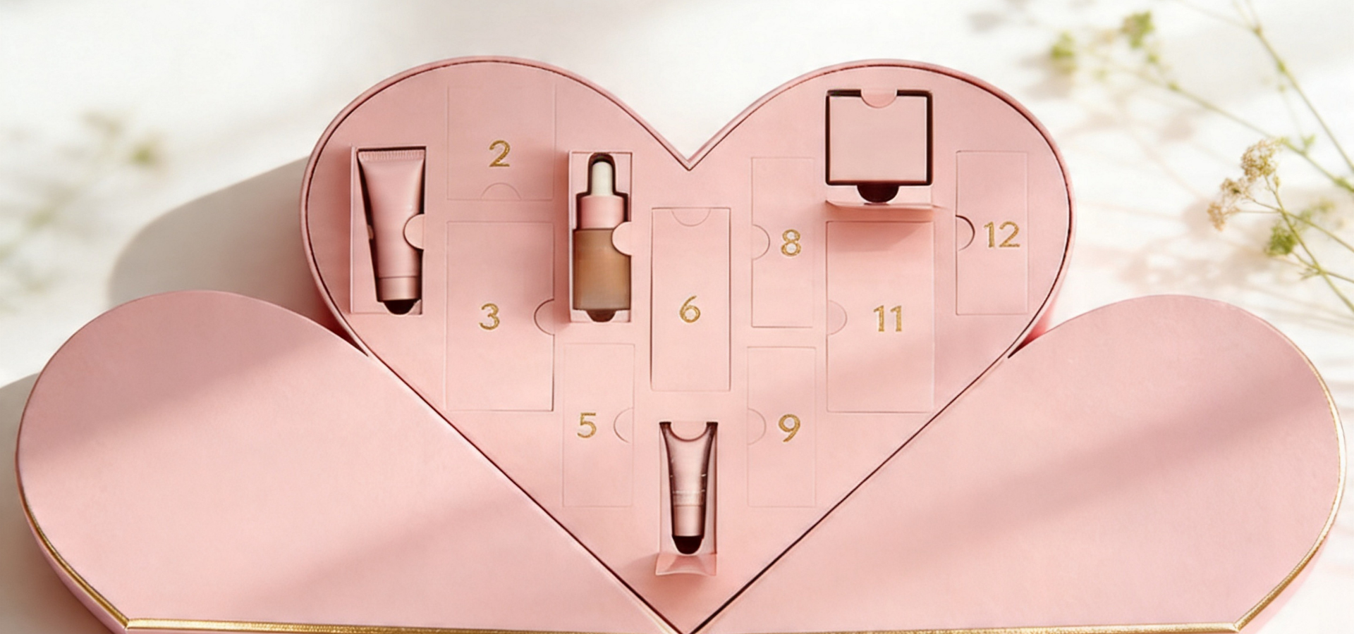Heart-shaped skincare set with various products on a light background